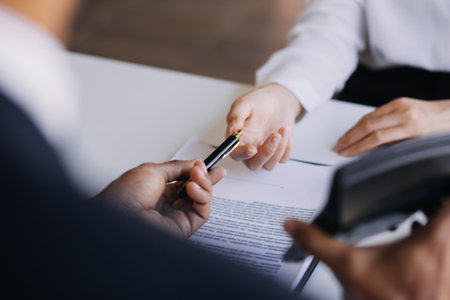 Real estate brokerage agent Deliver a sample of a model house to the customer, mortgage loan agreement Making lease and buy and sell house And contract home insurance mortgage loan conceptの写真素材