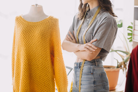 Beautiful lady blogger showing clothes in front of the camera to recording vlog video live streaming...