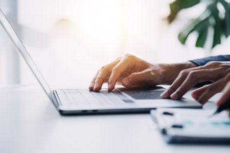 Entrepreneur Asian businessman and businesswoman discussing new business project in tablet in modern Meeting In Modern Office, Asian business casual concept.の写真素材