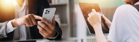 Financial analysts analyze business financial reports on a digital tablet planning investment...