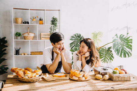 In Kitchen: Perfectly Happy Couple Preparing Healthy Food, Lots of Vegetables. Man Juggles with...
