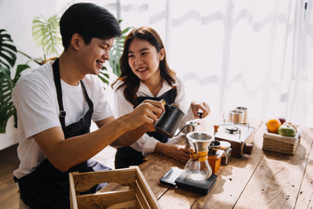 In Kitchen: Perfectly Happy Couple Preparing Healthy Food, Lots of Vegetables. Man Juggles with Fruits, Makes Her Girlfriend Laugh. Lovely People in Love Have Funの写真素材