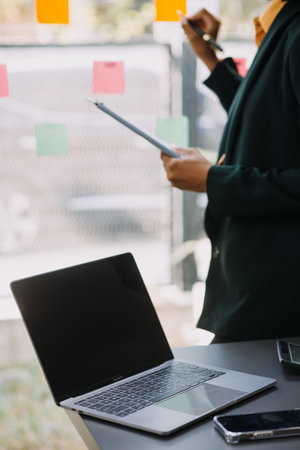 Entrepreneurs and business people conference in modern meeting room, happy multiracial coworkers have fun cooperating working together at office meeting, asian teamwork conceptの写真素材