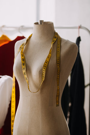 Fashion blogger concept, Young women selling clothes on video streaming.Startup small business SME, using smartphone or tablet taking receive and checking in studioの写真素材