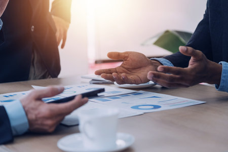 Entrepreneurs and business people conference in modern meeting room, happy multiracial coworkers have fun cooperating working together at office meeting, asian teamwork conceptの写真素材