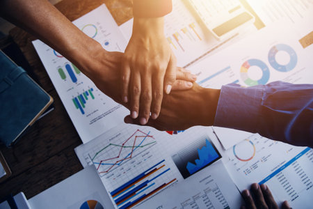 Business handshake for teamwork of business merger and acquisition,successful negotiate,hand shake,two businessman shake hand with partner to celebration partnership and business deal conceptの写真素材