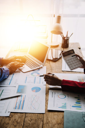 Businessman working at office with documents on his desk, doing planning analyzing the financial report, business plan investment, finance analysis conceptの写真素材