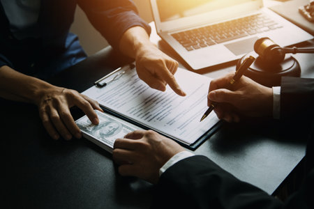 Justice and Law concept. Legal counsel presents to the client a signed contract with gavel and legal...