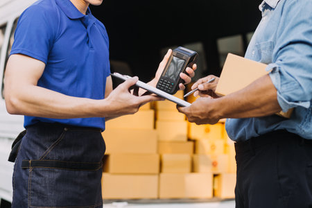 Asian business men use laptop computer checking customer order online shipping boxes at home. Starting Small business entrepreneur SME freelanceの写真素材