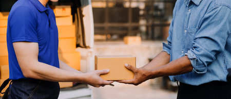Asian business men use laptop computer checking customer order online shipping boxes at home. Starting Small business entrepreneur SME freelanceの写真素材