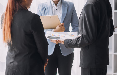 Businesswoman or accountant working Financial investment on calculator, calculate, analyze business and marketing growth on financial document data graph, Accounting, Economic, commercial concept.mの写真素材