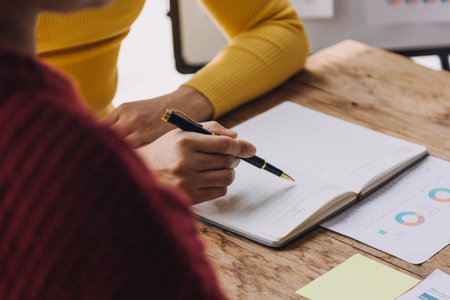 Businesswoman or accountant working Financial investment on calculator, calculate, analyze business and marketing growth on financial document data graph, Accounting, Economic, commercial concept.mの写真素材