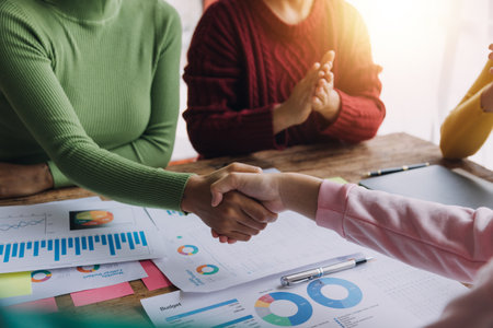 Business handshake for teamwork of business merger and acquisition,successful negotiate,hand shake,two businessman shake hand with partner to celebration partnership and business deal conceptの写真素材