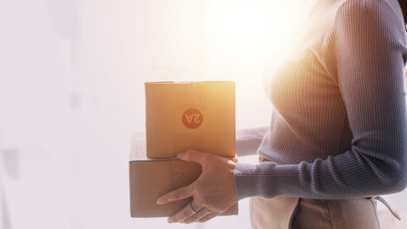 Business woman start up small business entrepreneur SME success .freelance woman working at home with Online Parcel delivery. SME and packaging deliveryconceptの写真素材