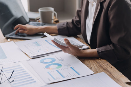 Business Documents, Auditor businesswoman checking searching document legal prepare paperwork or report for analysis TAX time,accountant Documents data contract partner deal in workplace officeの写真素材