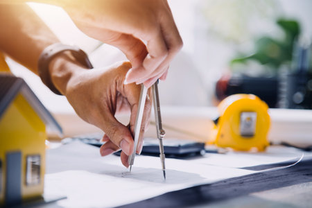 Two business man construction site engineer. Engineering objects on workplace with partners interacting on backgroundの写真素材