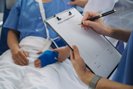Man with broken arm in cast lying on bed in hospital. The emergency center treatment is plaster and hangs with sling for a further cure in an orthopedic clinic. Patient pain from accident injury.の写真素材