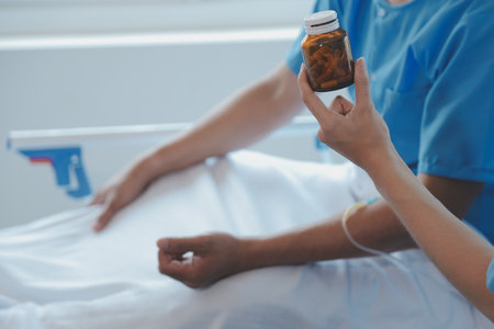 Women Asian doctors hold the patient hand and encourage and provide medical advice While checking the patient health in bed. Concept of Care and compassion, antenatal care, Threatened abortionの写真素材