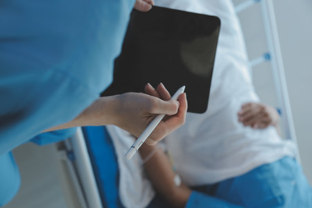 Women Asian doctors hold the patient hand and encourage and provide medical advice While checking the patient health in bed. Concept of Care and compassion, antenatal care, Threatened abortionの写真素材