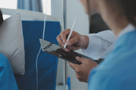 Women Asian doctors hold the patient hand and encourage and provide medical advice While checking...