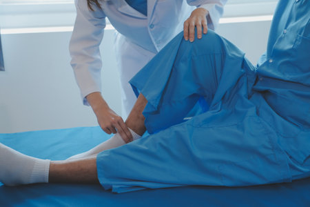 Physiotherapist working with patient in clinic, closeupの写真素材