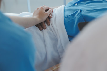 Women Asian doctors hold the patient hand and encourage and provide medical advice While checking the patient health in bed. Concept of Care and compassion, antenatal care, Threatened abortionの写真素材
