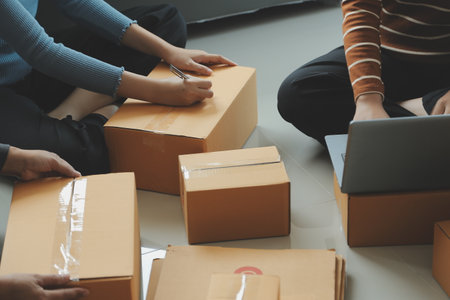 Business woman start up small business entrepreneur SME success .freelance woman working at home with Online Parcel delivery. SME and packaging deliveryconceptの写真素材