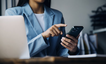 Business Documents, Auditor businesswoman checking searching document legal prepare paperwork or report for analysis TAX time,accountant Documents data contract partner deal in workplace officeの写真素材