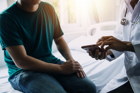 A health visitor with tablet explaining a senior woman how to take pills.の写真素材