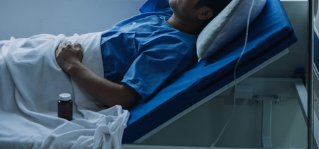 Side view of diverse doctors examining Asian female patient in bed in ward at hospital.の写真素材