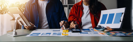 Close up ux developer and ui designer brainstorming about mobile app interface wireframe design on...