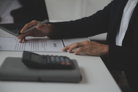 Close up view of job interview in office, focus on resume writing tips, employer reviewing good cv of prepared skilled applicant, recruiter considering application, hr manager making hiring decisionの写真素材