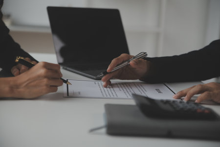 Close up view of job interview in office, focus on resume writing tips, employer reviewing good cv of prepared skilled applicant, recruiter considering application, hr manager making hiring decisionの写真素材