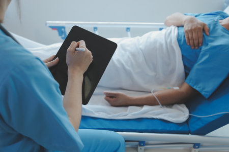 Women Asian doctors hold the patient hand and encourage and provide medical advice While checking...