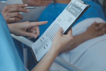 Women Asian doctors hold the patient hand and encourage and provide medical advice While checking the patient health in bed. Concept of Care and compassion, antenatal care, Threatened abortionの写真素材