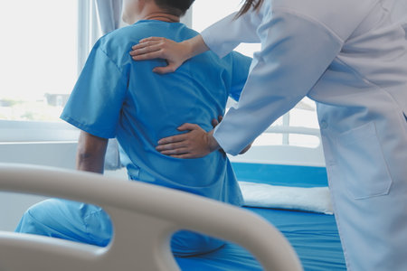 Women Asian doctors hold the patient hand and encourage and provide medical advice While checking the patient health in bed. Concept of Care and compassion, antenatal care, Threatened abortionの写真素材