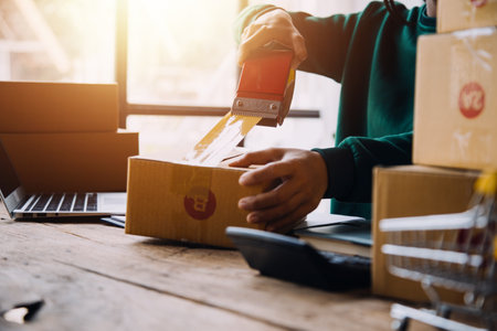 Business woman start up small business entrepreneur SME success .freelance woman working at home with Online Parcel delivery. SME and packaging deliveryconceptの写真素材