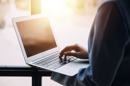 Financial analysts analyze business financial reports on a digital tablet planning investment...