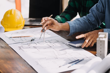 Two business man construction site engineer. Engineering objects on workplace with partners interacting on backgroundの写真素材
