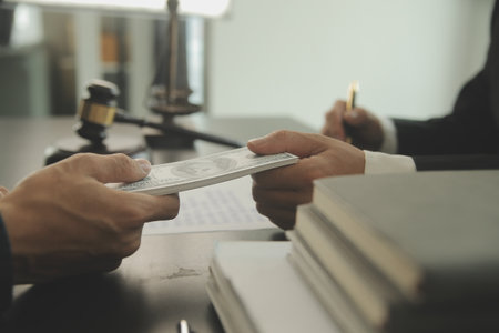 Justice and Law concept. Legal counsel presents to the client a signed contract with gavel and legal...