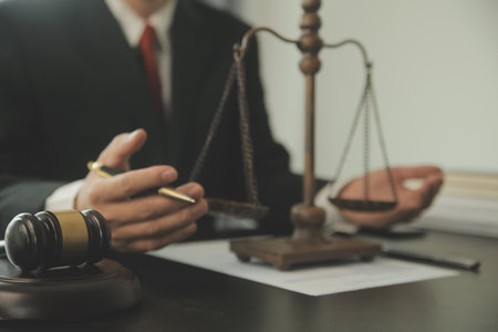 Justice and Law concept. Legal counsel presents to the client a signed contract with gavel and legal...