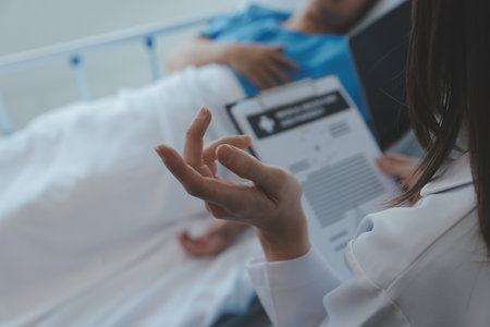 Injured patient showing doctor broken wrist and arm with bandage in hospital office or emergency room. Sprain, stress fracture or repetitive strain injury in hand. Nurse helping customer. First aid.の写真素材