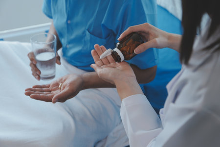 Injured patient showing doctor broken wrist and arm with bandage in hospital office or emergency room. Sprain, stress fracture or repetitive strain injury in hand. Nurse helping customer. First aid.の写真素材