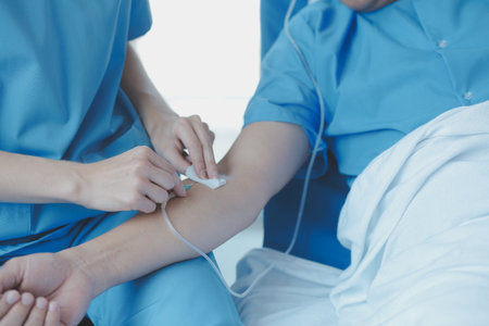 Injured patient showing doctor broken wrist and arm with bandage in hospital office or emergency room. Sprain, stress fracture or repetitive strain injury in hand. Nurse helping customer. First aid.の写真素材