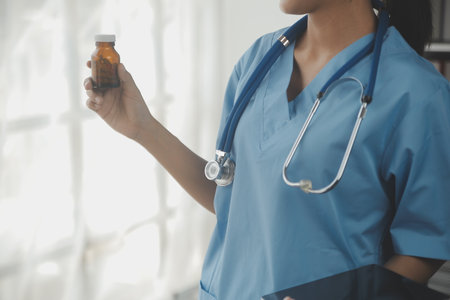 Healthcare and medical concept. Medicine doctor with stethoscope in hand and Patients come to the hospital background.の写真素材