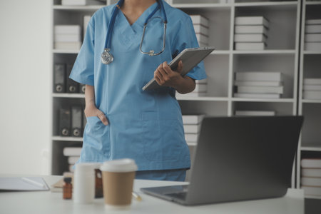 Healthcare and medical concept. Medicine doctor with stethoscope in hand and Patients come to the hospital background.の写真素材