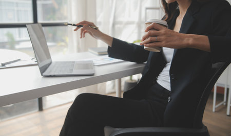 Business Documents, Auditor businesswoman checking searching document legal prepare paperwork or report for analysis TAX time,accountant Documents data contract partner deal in workplace officeの写真素材