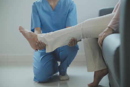 Patient doing some special exercises under supervision in a roomの写真素材