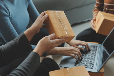 Business woman start up small business entrepreneur SME success .freelance woman working at home with Online Parcel delivery. SME and packaging deliveryconceptの写真素材