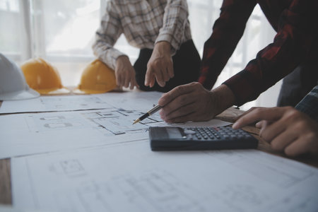 Two business man construction site engineer. Engineering objects on workplace with partners interacting on backgroundの写真素材